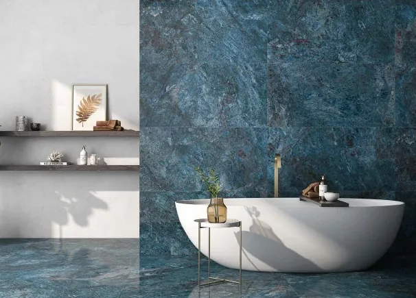 Blue marble-look tiles with a freestanding tub