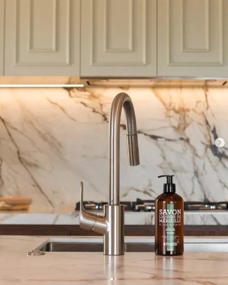 Kitchen mixer tap on a marble-look counter